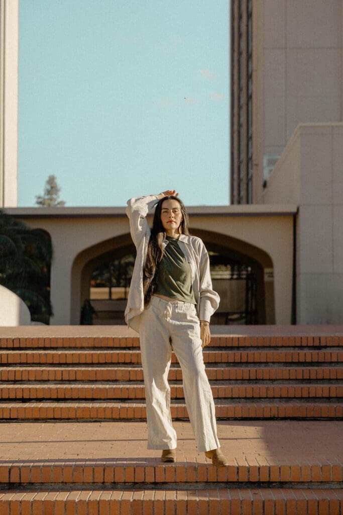 Full-length Tucson lifestyle portrait standing on brick steps in the desert sun