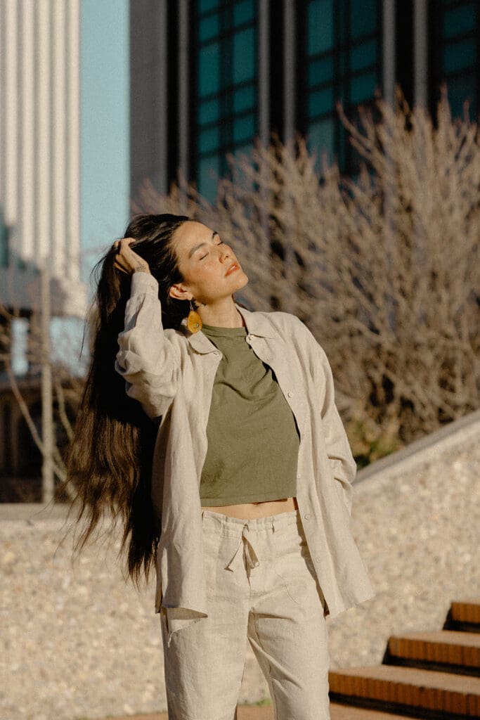 Editorial desert lifestyle portrait against warm Tucson architecture